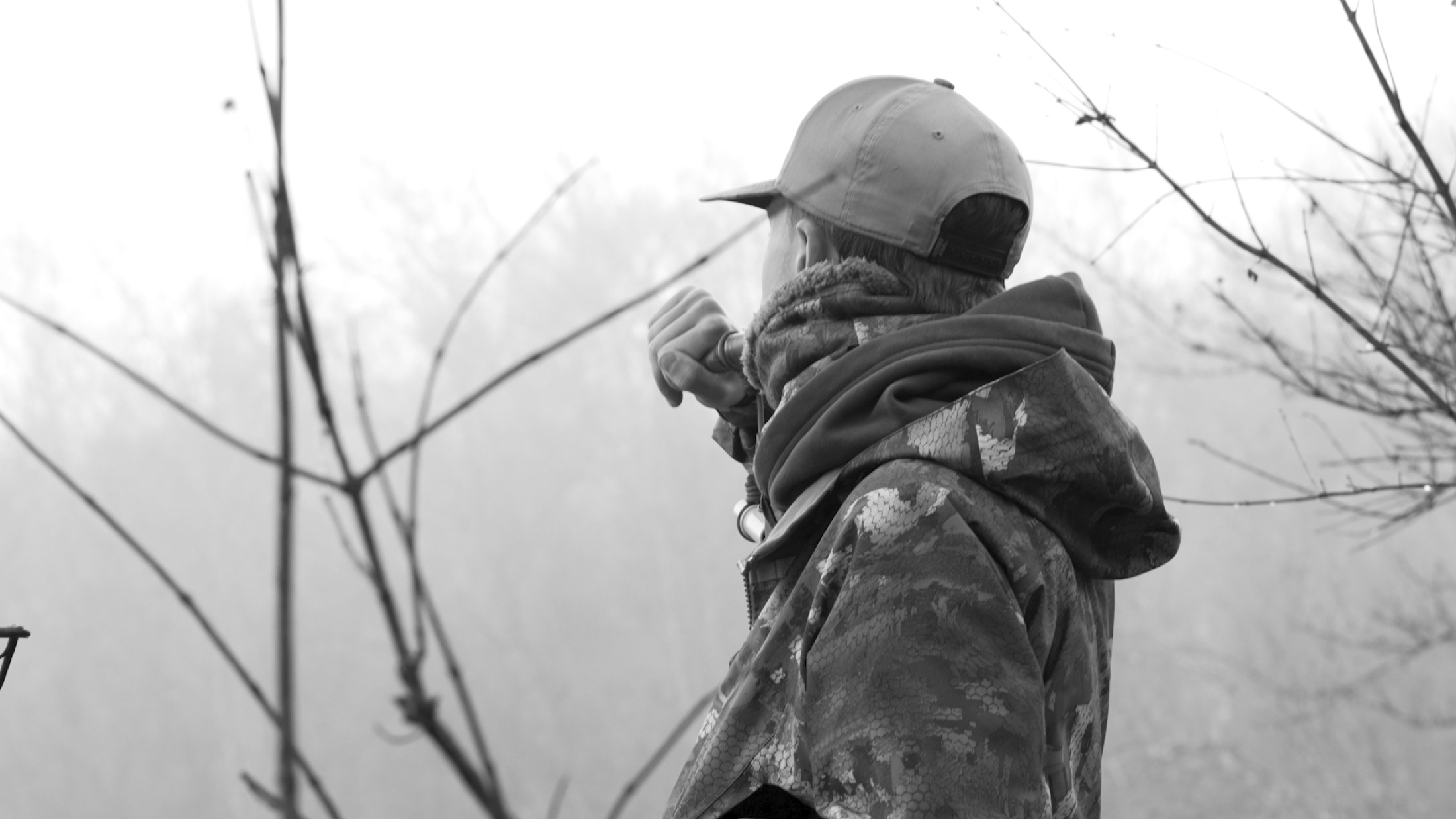 Silhouette of a hunter in the woods at dawn — Divine Outdoors Co.